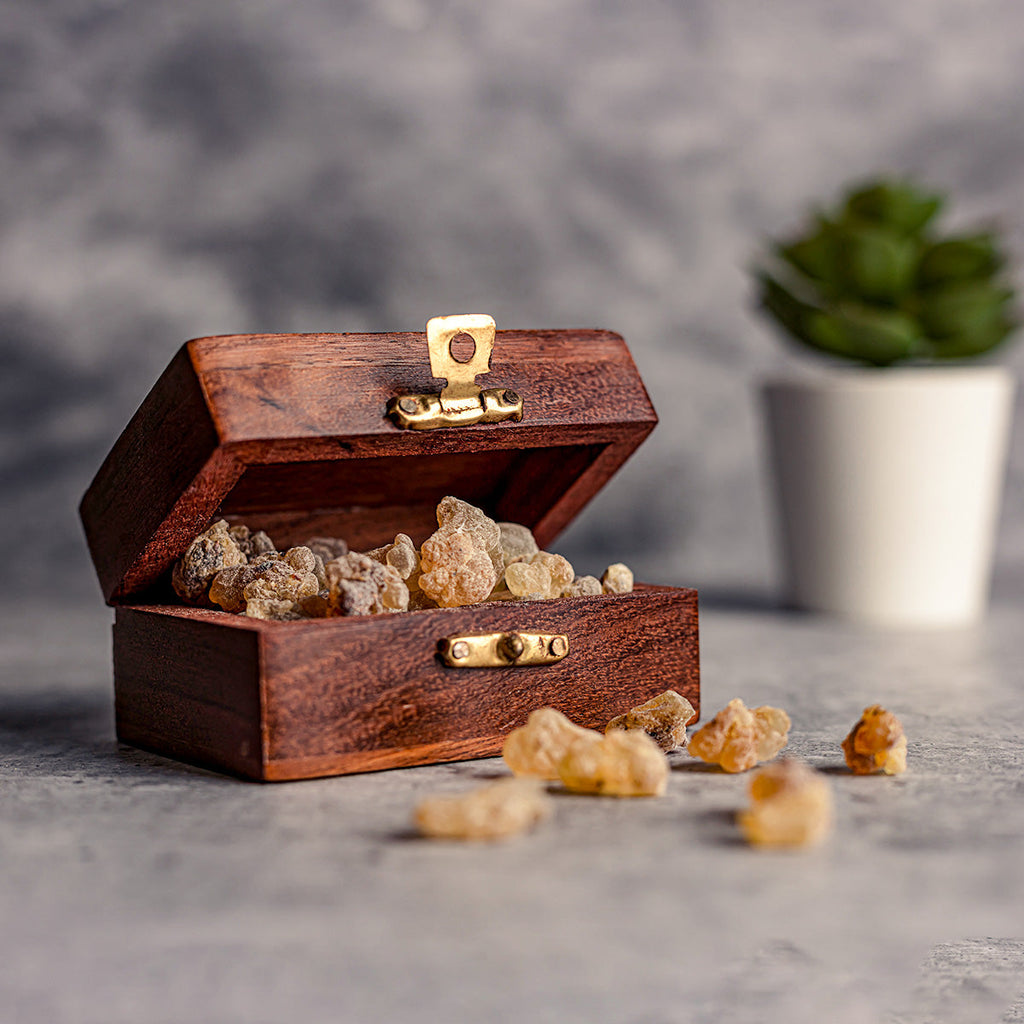 A well crafted wooden box full of frankincense resin